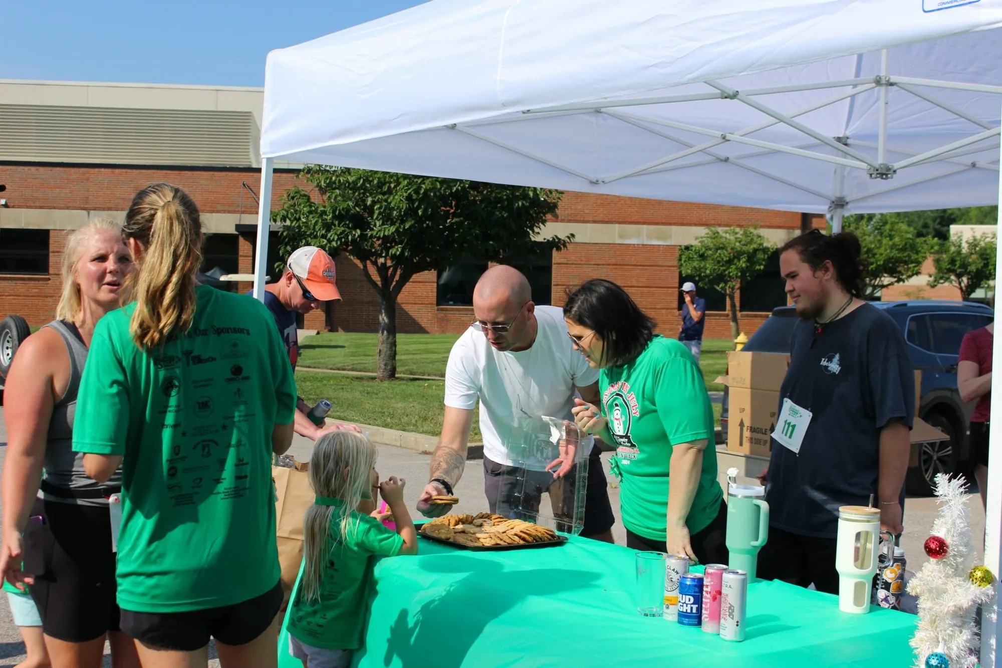 Volunteers serving pancakes to runners at the post-race tent.
