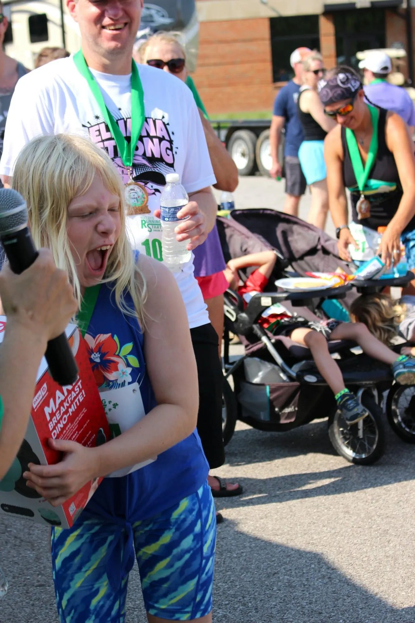 A woman reacting with delight as she wins a raffle prize.